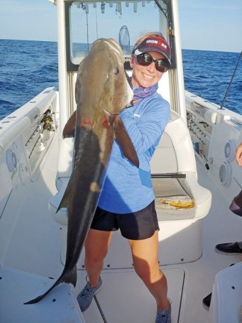 Ally Deming with her personal best cobia—48 in., 55 lbs.— hooked off Sebastian Inlet  on the last drift of the day.
