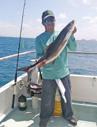 Orlando with a nice cobia caught aboard the Catch My Drift