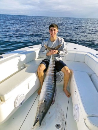 Elliot London, owner of BaitStrips, caught this 65lb wahoo out of Hillsboro Inlet on his very own product, BaitStrips.