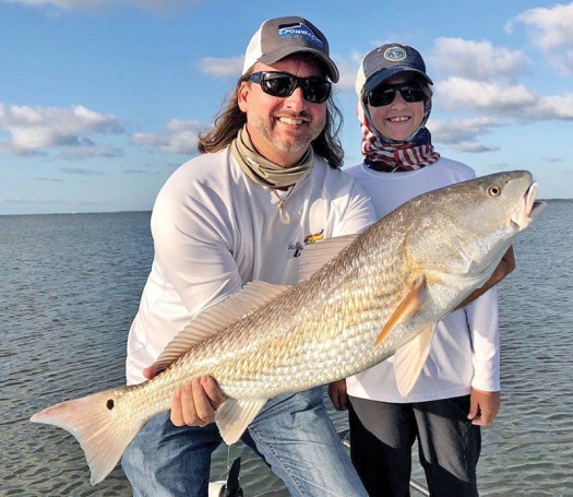David and his son Tyler  hooked this nice redfish in the Mosquito Lagoon  with Capt. Travis Tanner.