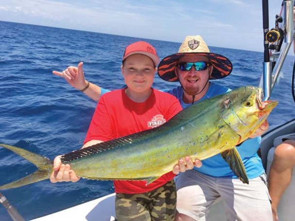 Junior angler nabbed a respectable mahi mahi offshore fishing  with Fired Up Charters.