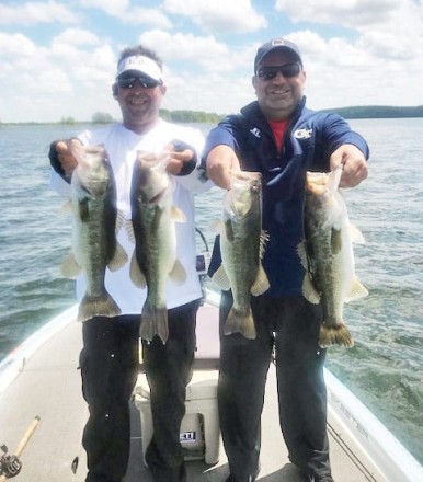 Joe Paoletti and guide Paul Tyre haulin in big Seminole bass.