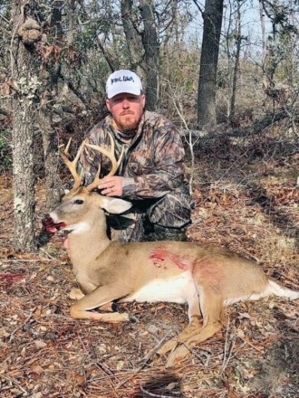 Phillip Hicks, founder of  Pool Commander, with an  8-point Bay Co. buck.