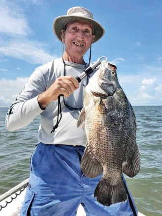 Winston Chester with a nice tripletail fishing with guide Chris Gouras.