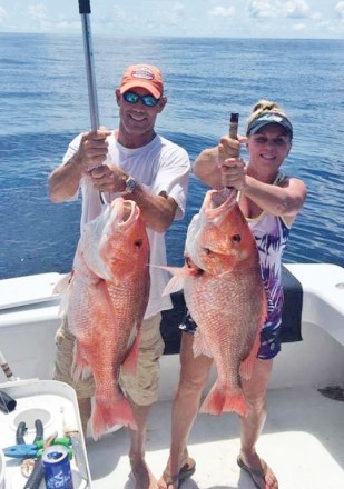 Mike and Stephanie Hobbs with some big snapper