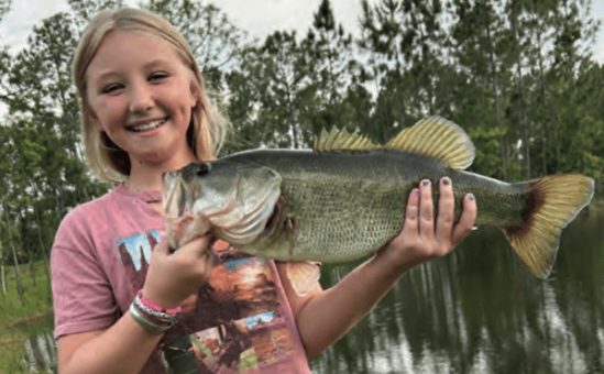 Hailey Moriarty with a nice bass from a private pond