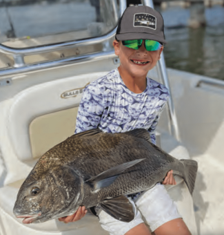 Reef Jaffe brought this 36-inch black drum into the boat under Mathers Bridge using live shrimp.