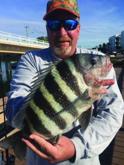 Ron Miller of Englewood sharing a 19” sheepshead.
