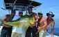 Danny "Reef Donkey" Peterson, Capt Mark Smith, Wade Wells, Shannon Pyle and Tim Kennedy celebrate a 30+ mahi caught by Tim.