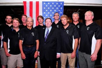 (2)	U.S. Champion Sailors with David Allen the Political, Economic and Commercial Chief of the U.S. Embassy in Nassau at the Nassau Yacht Club. L to R: U.S. Champion Sailors: Joshua Revkin, George Szabo, Brian Fatih, Augie Diaz, Luke Lawrence, David Allen