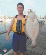 Joey Scrofani with his 6lb 0oz fluke he weighed in at Snug Harbor Marina on July 6th!