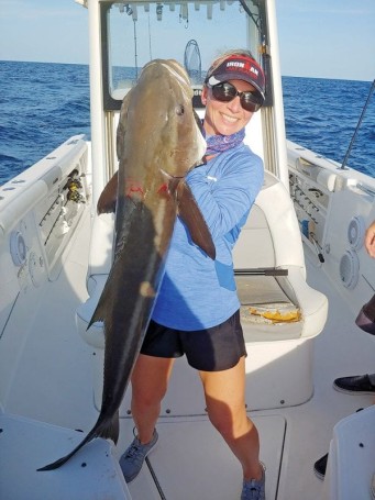 Ally Deming with her personal best cobia—48 in., 55 lbs.— hooked off Sebastian Inlet on the last drift of the day.