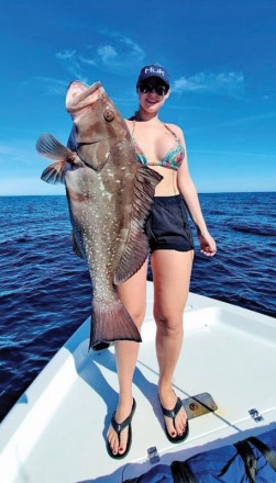 Rachel Sawyer with a nice red grouper caught on a live ballyhoo.