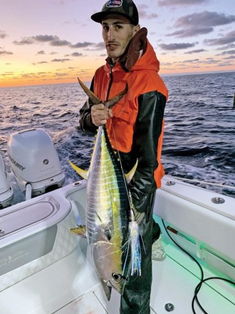 Nick Catsoulis with a yellowfin tuna caught in the Bahamas while high speeding for wahoo.