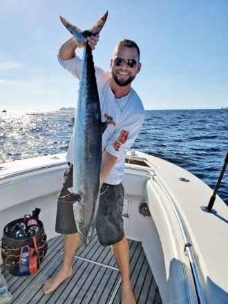 Matt Gonzalez with a 33 pound kingfish caught with a dead ballyhoo on a jig.