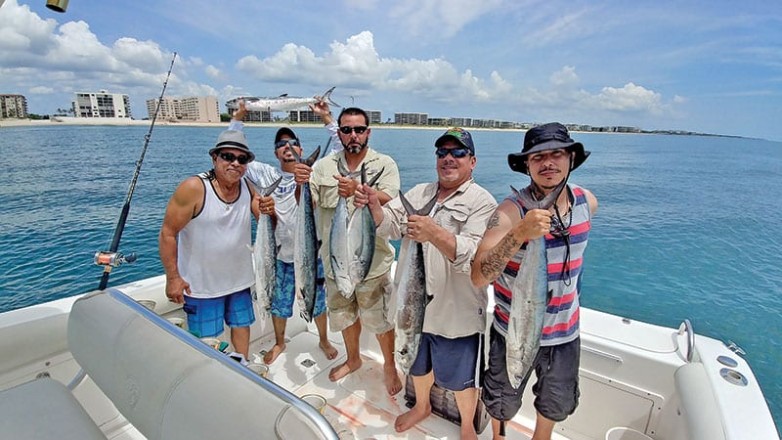 The Garcia boys with a nice catch aboard the Gray Ghost with Capt. Chris Dyer.