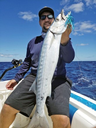 Chris Pascual with a nice barracuda caught on a Mahi Maniacs lure.