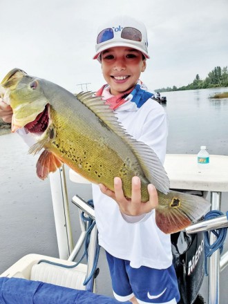 Niko celebrated his 10th birthday by catching a nice peacock bass with SamCanFish.com
