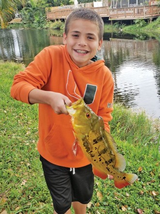 Nick Dyer with a backyard peacock