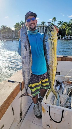 Loyal reader Chris Pascual with a wahoo and dolphin caught on a charter trip with Fishing Headquarters