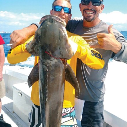Andrew and Mick with a big cobia caught on the New Lattitude.