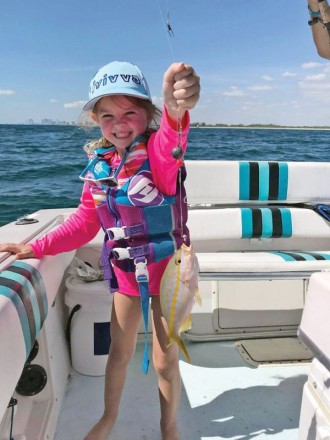 Six-year-old Cambree with her first yellowtail snapper