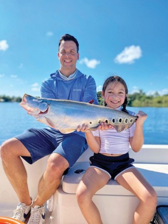 8 year old Isabella and her dad Alex with her first ever clown knife fish.
