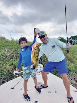 Seven year old Ian Paguaga scored a nice peacock while  fishing with his Uncle Bob.