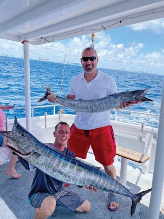 Double header wahoo caught aboard the Catch My Drift