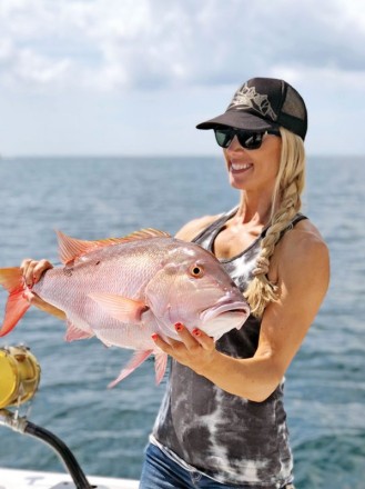 Nice mutton snapper caught by this  fisher gal with Fishing Headquarters.