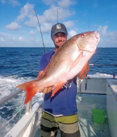 Ryan with a nice mutton snapper caught aboard the Catch My Drift.