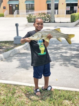 Seven-year-old Sandro Toruno with a very respectable freshwater snook