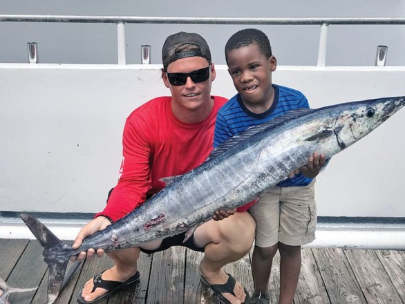 Tyler helped this kiddo catch this nice wahoo fishing with Fishing Headquarters.