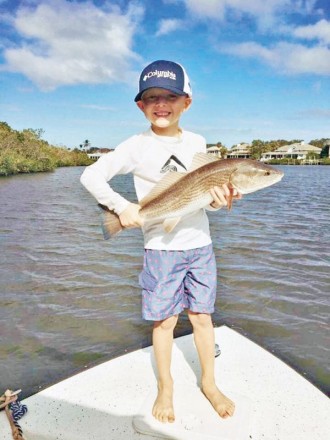 Luke Morgan, 7, repped the 954 in Vero Beach with his dad and caught his first redfish!