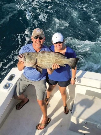 This couple scored a nice grouper aboard the Big Game