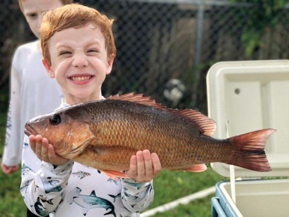 This mangrove snapper put a big smile on 5 year old Shane Prieto’s face.