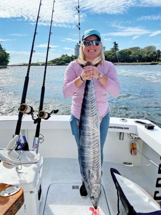 Jessica Montanaro caught this wahoo, her first fish ever, with Father and Son Sportfishing.