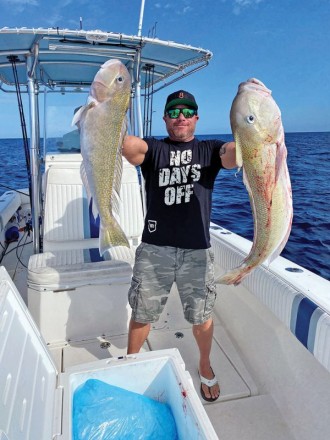 Two big golden tilefish caught deep dropping with Family Jewell Sportfishing.