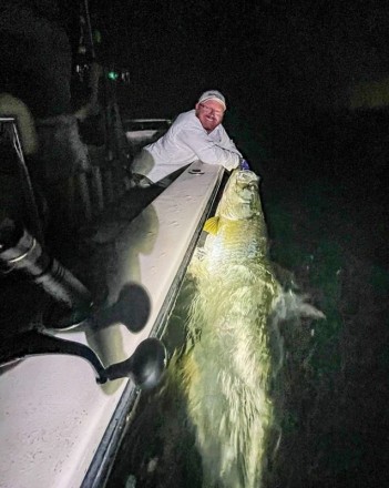 Win Farnsworth with a huge tarpon caught and released with South Florida Fishing Charters.