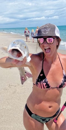 Katie Santure celebrated during her birthday weekend by catching this 40-inch redfish on a Penn passion off the beach in Melbourne.