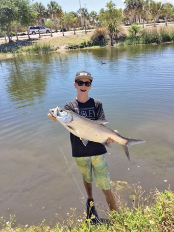 Kai Hobbs was fishing for bass with live bluegill and, when he hooked up, thought he had a pond record bass until he saw it jump and realized he caught his first freshwater tarpon!