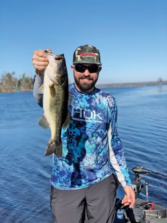 Travis Poole with a fine Deerpoint bass