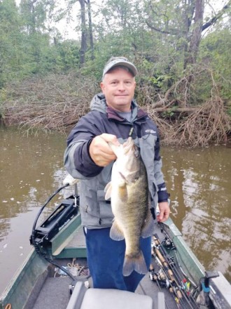 Aaron with a nice  Flint River shoal bass.