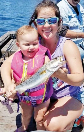 Adelynn “Creek Chub” Hallett and Allison Possum Hellet of PC with a nice trout