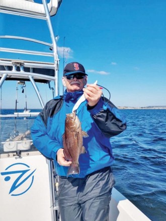 Bob Hill with a scamp caught in the bay.