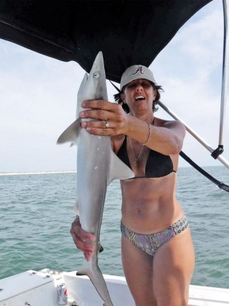 Cinda making friends with our local sharks