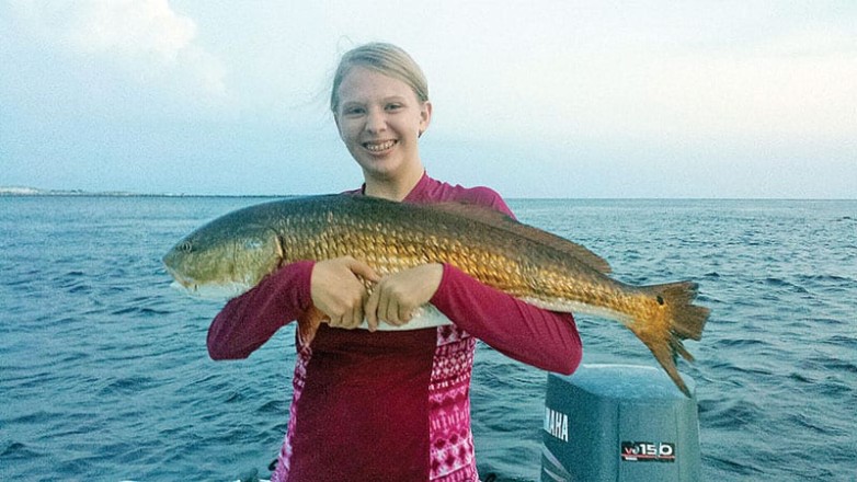 Emily caught this sweet red fishing with her brother, Kyle, and her dad.