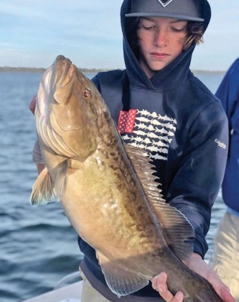 Jake Williams of Panama City with a nice bay grouper fishing with Capt. Daryl, Liquid Native Charters