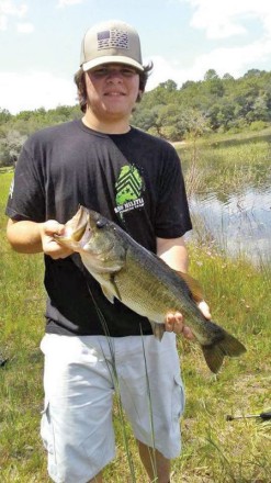 Lancin Dybdal with a nice Grassy Pond bass.