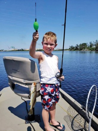 Layton Hall-Resnikoff hauling in some bay trout